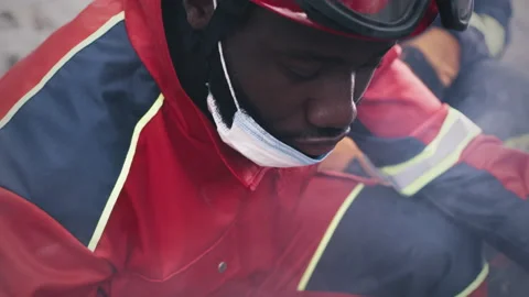 Black paramedic working after disaster Stockbeeldmateriaal 166146061