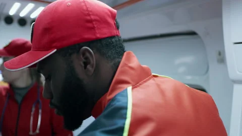 Black paramedic working in ambulance Video stock 167967556