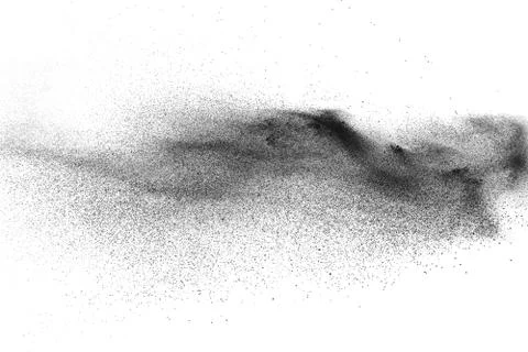 Black particles splatter on white background. Stock Photos