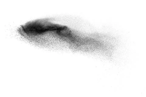 Black particles splatter on white background. Black powder dust exploding. Stock Photos
