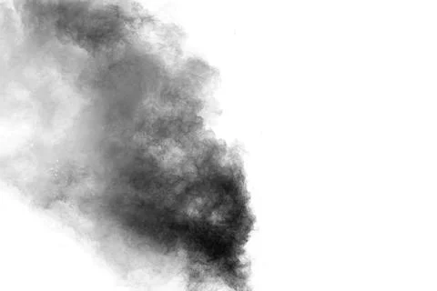 Black particles splatter on white background. Black powder dust burst. Stock Photos