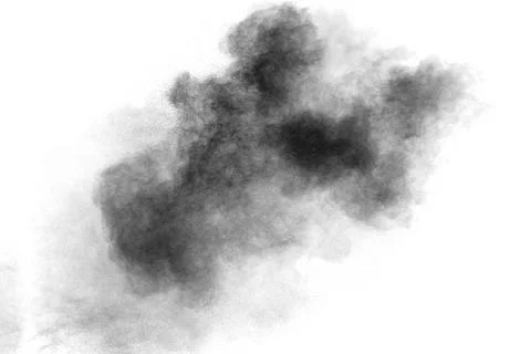 Black particles splattered on white background. Black powder dust splashing. Stock Photos