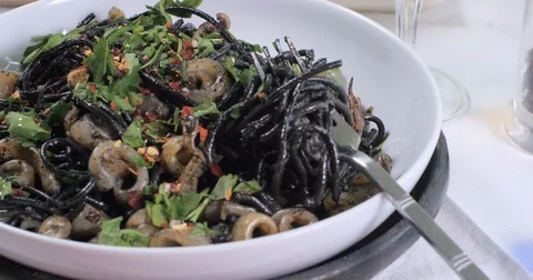 Black pasta with squids (cuttlefish) and ink Stock Footage 75007437