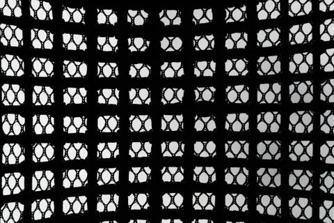Black patterned net tile texture on white Stock-Fotos