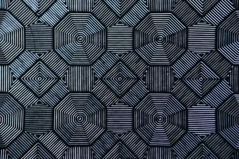 Black patterned tiles in form of rhombuses closeup Foto stock