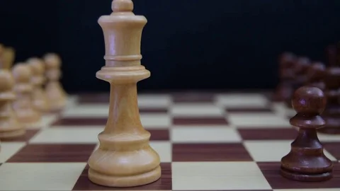 Black pawn challenging white queen Stock Footage 78619749
