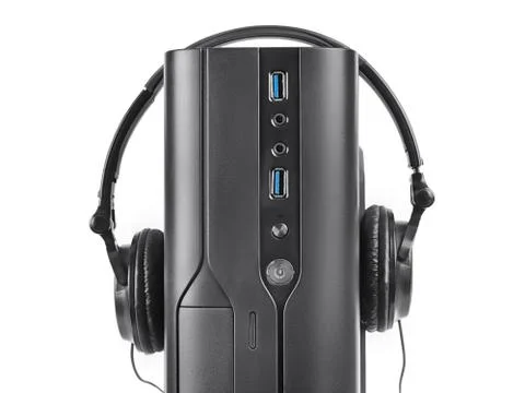 Black PC case close up with head earphones isolated with clipping path Foto stock