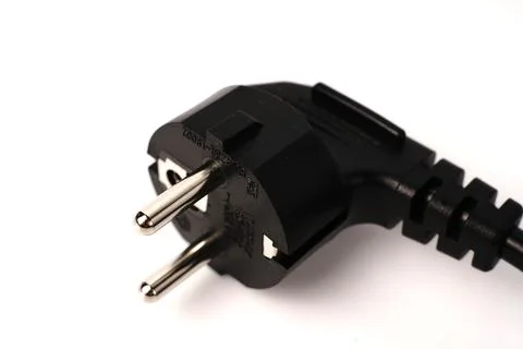 Black PC power cable on white background. Close Stock Photos