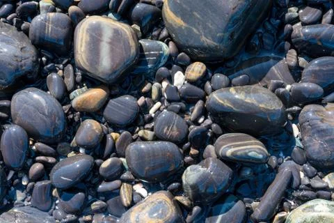 Black pebble stone background Stock Photos