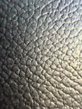 Black pebbled artificial leather texture macro Stock Photos