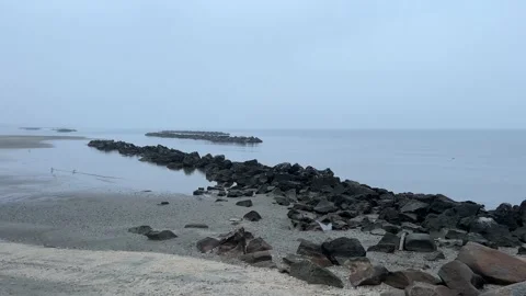 Black pebbles along the beach Stock Footage 231631352