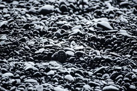 Black pebbles background Stock Photos