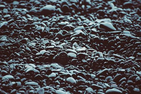 Black pebbles background Stock-Fotos