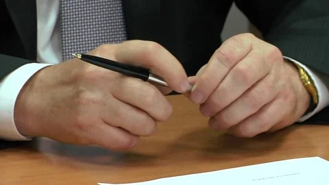Black pen in hands Stock Footage 70462284