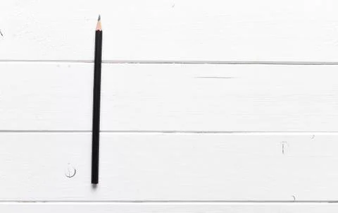 Black pencil on a table Stock Photos