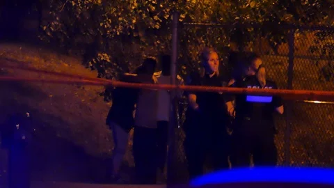 Black people hugging at murder scene Stock Footage 116096818