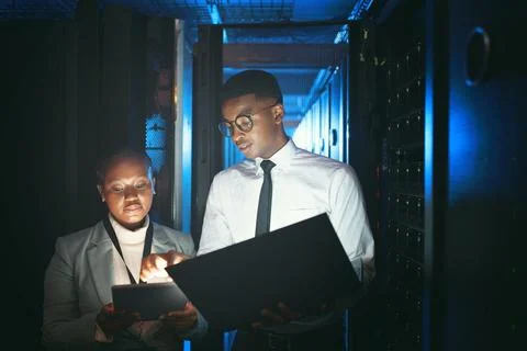 Black people, programming and tablet in server room at night for research Foto stock