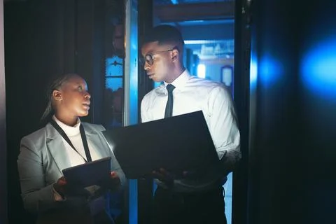 Black people, programming and tech in data center at night for research, co.. Stock Photos