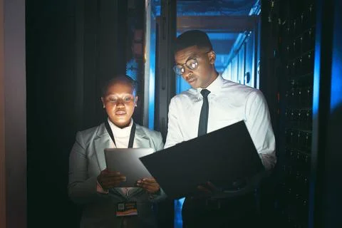 Black people, programming and tech in server room at night for research, coding Stock Photos
