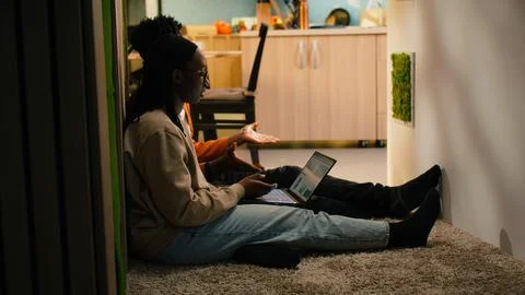 Black people reviewing data analytics on charts from their cozy home Stock Photos