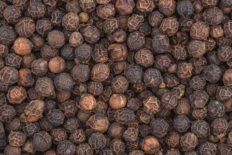 Black pepper background close up. Stock Photos