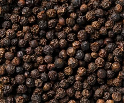 Black pepper as a background. Or texture Stock Photos