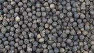 Black Pepper Close Up.   Front Of The Camera Rotates Plate With Black Pepper Stock Footage