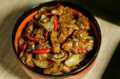 Black pepper cooked with vegetables and chili peppers Stock Photos