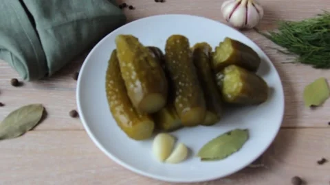 Black pepper falls on the pickled cucumbers Stock Footage 154180940