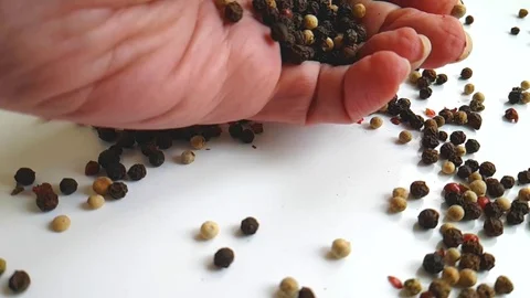 Black pepper hand slow-motion shot Stock Footage 89253032