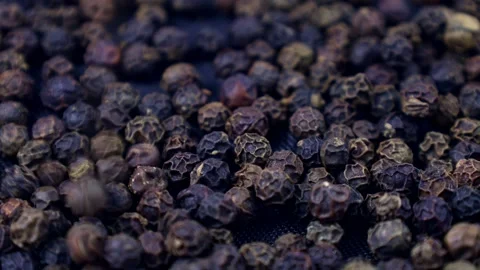 Black pepper peppercorns falling down close up Stock Footage 270475776