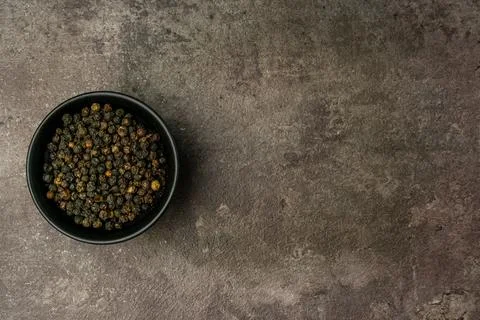 Black Pepper Seeds from a flat lay angle with a dramatic dark background. Stock Photos