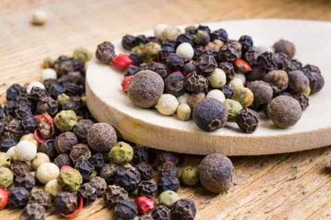 Black pepper in spoon Stock Photos