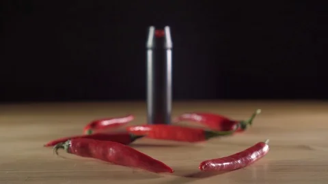 Black pepper spray bottle on the table Stock Footage 121481668