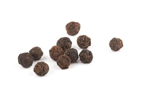 Black pepper on white Stock Photos