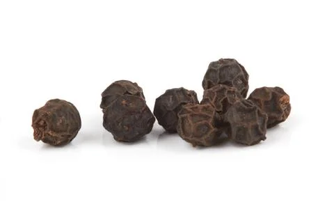 Black pepper on white Stock Photos