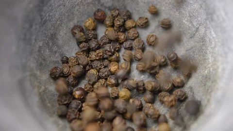 Black Peppercorns Falling into Kitchen Mortar Slow Motion Stock Footage 146805978
