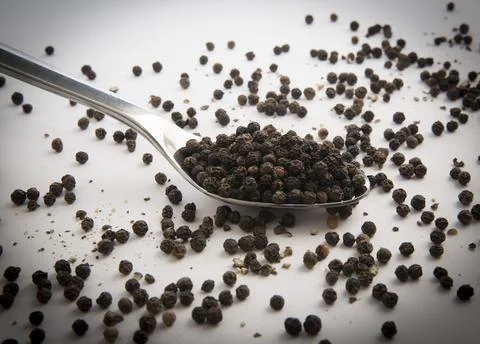 Black peppercorns in a kitchen Stock Photos