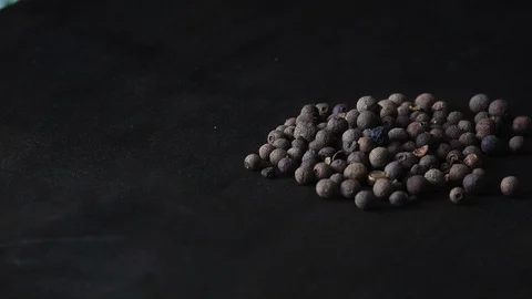 Black peppercorns rotating Stock Footage 101762772