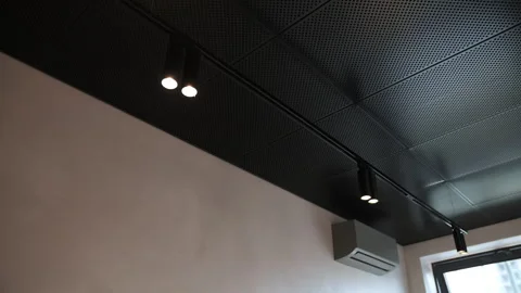Black perforated ceiling with spotlights and LED strip Stock Footage 311278620