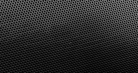 Black perforated surface texture. Vídeos de archivo 332931171