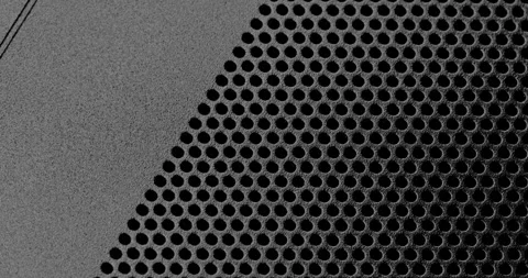 Black perforated surface texture. Vídeos de archivo 333395521