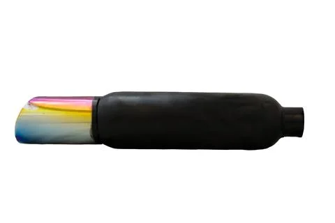 Black performance muffler with burnt titanium tip displaying rainbow coloration. Stock Photos