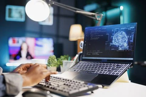 Black person computing code on laptop Stock-Fotos