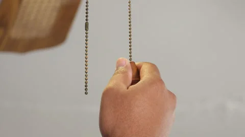 Black person pulls light switch on and off Stock Footage 135847925