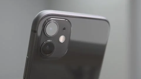 Black phone with two lens camera on the back zooming in shot. Stock Footage 250515713