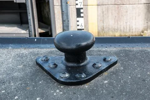 Black pile beside the empty ship lock Stock Photos