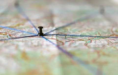 The black pin marks a location on a map with routes Фото