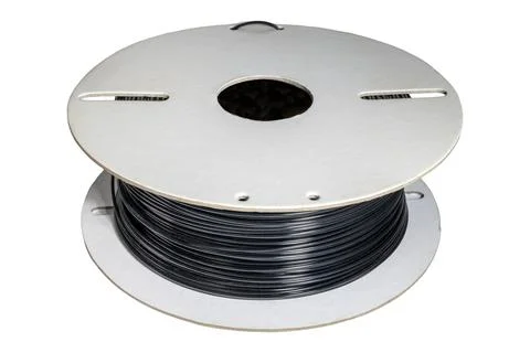 Black PLA filament spool for 3D printing extrusion process Stock Photos