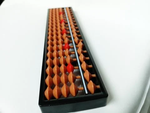 Black plastic abacus with brown and red rows of beads Stock Photos